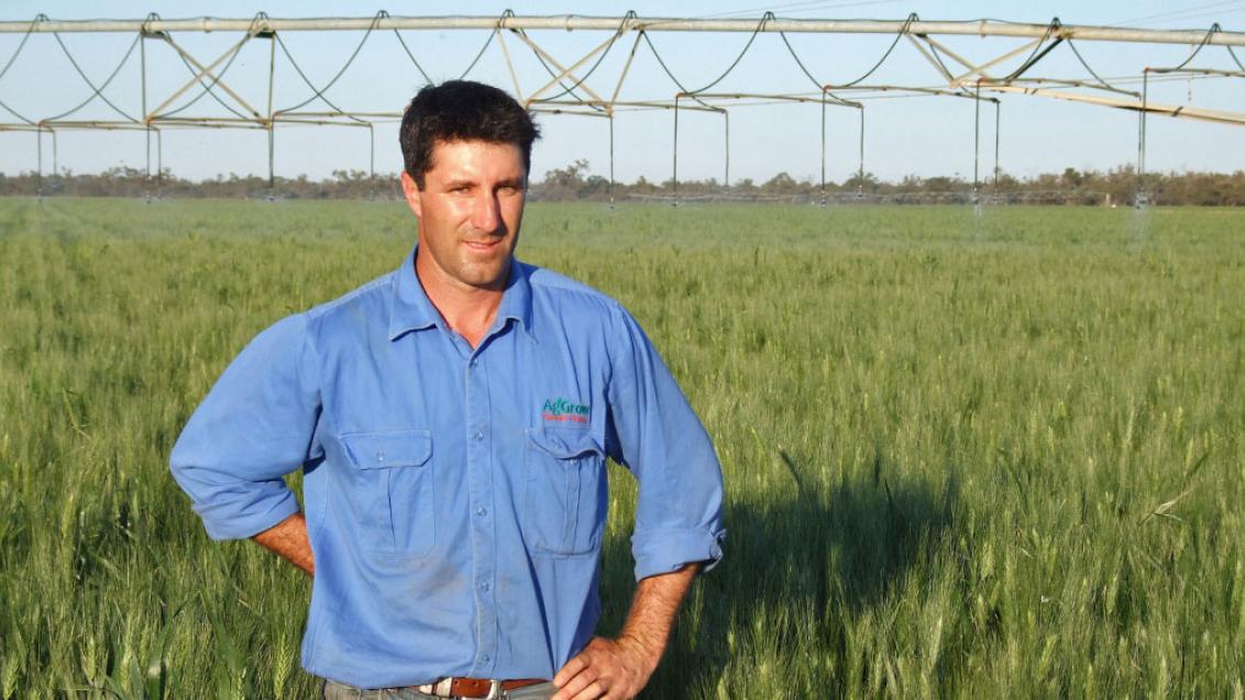 man in front of a field 
