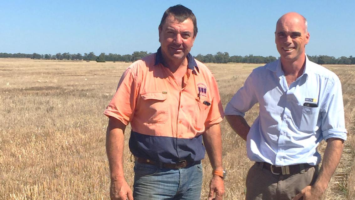 two men in dry field 