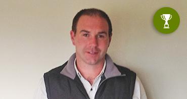 james burbury next to trophy symbol 