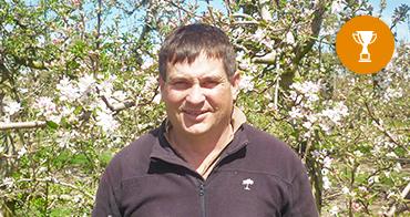 Lachlan Mckay next to trophy Icon