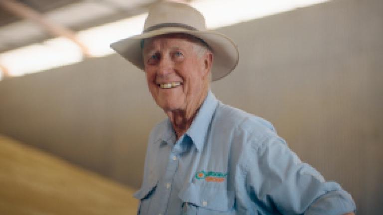 Tom Woods of Woods Group standing with healthy wheat harvest