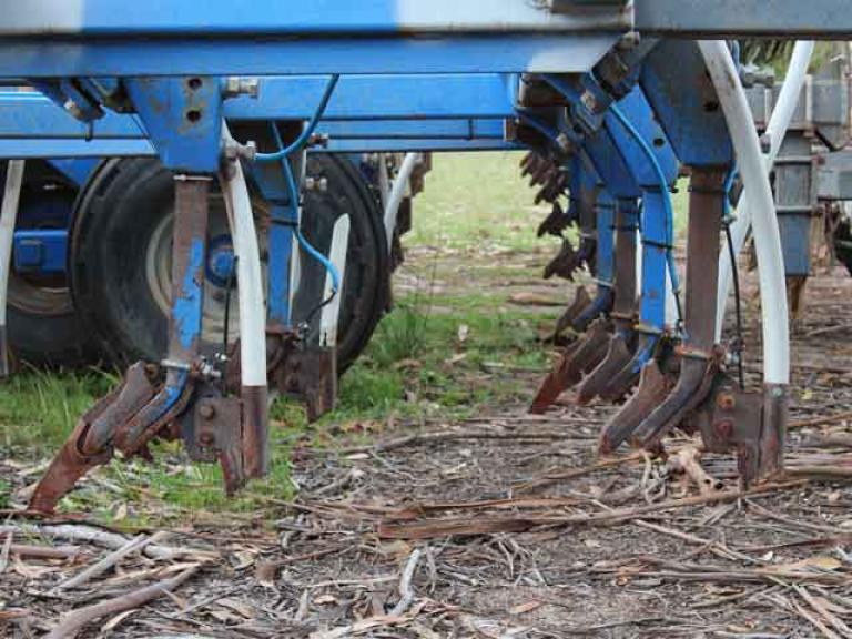 Wayne is using an AgMaster single boot to lay the fertilizer in the furrow with the seed.