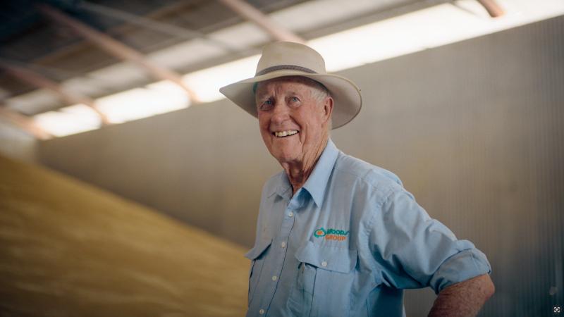 Tom Woods of Woods Group standing with healthy wheat harvest